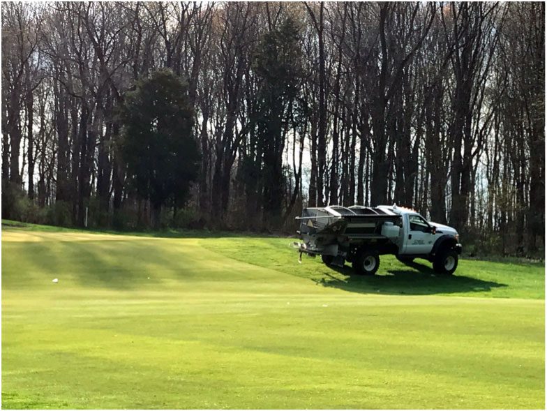 fertilization truck on golf course