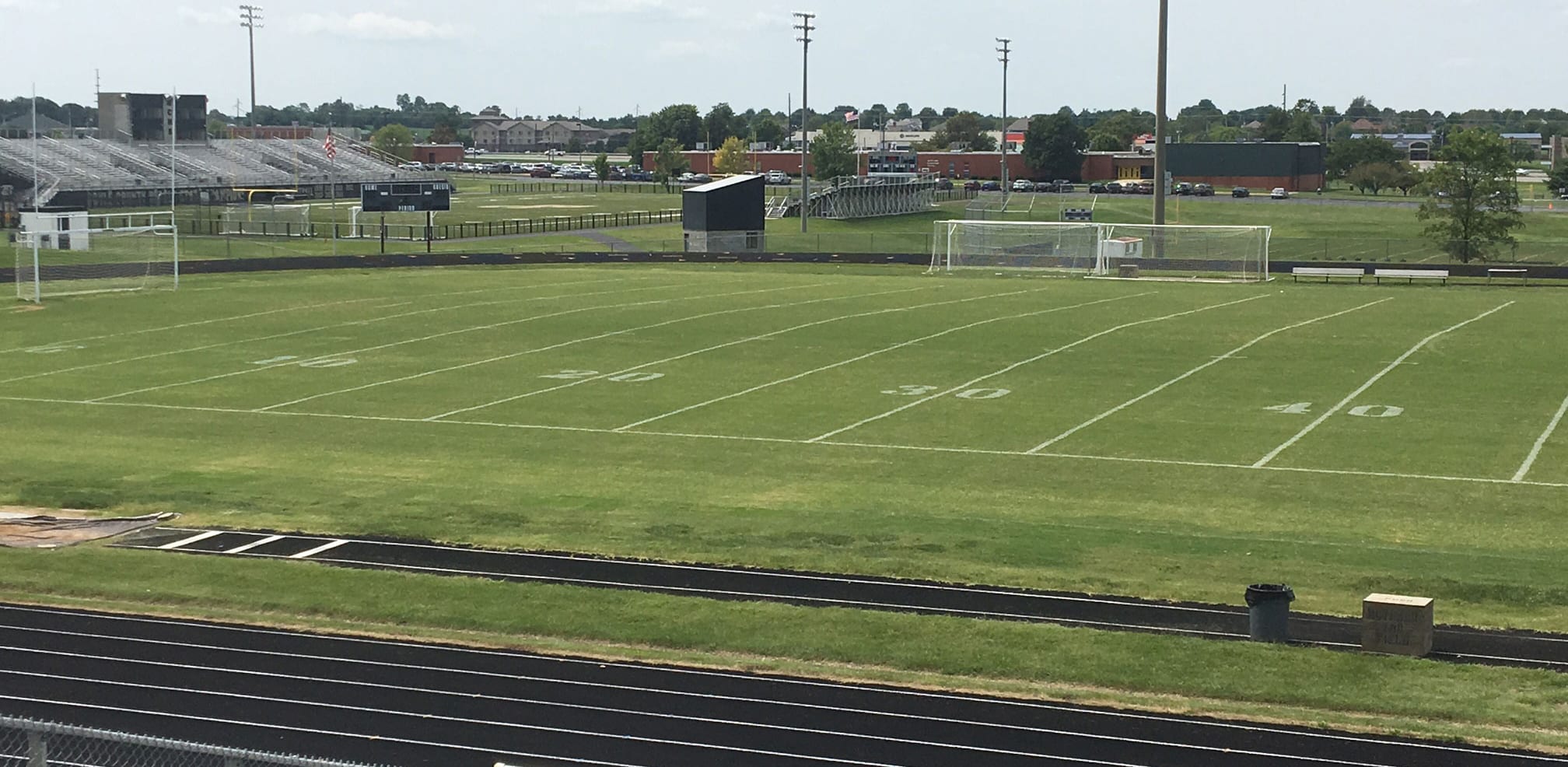 landscape view of soccer field with fresh mowed grass and line marking